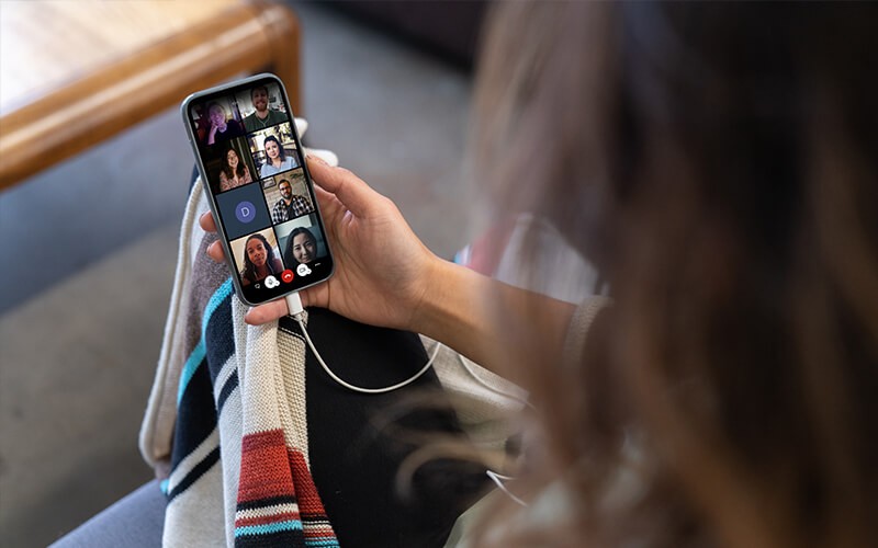 Woman having a meeting using her phone