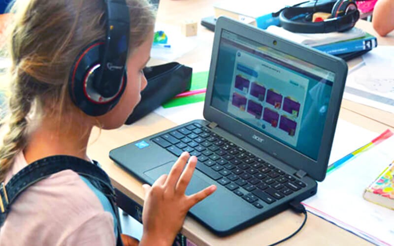 Girl using Acer Chromebook laptop