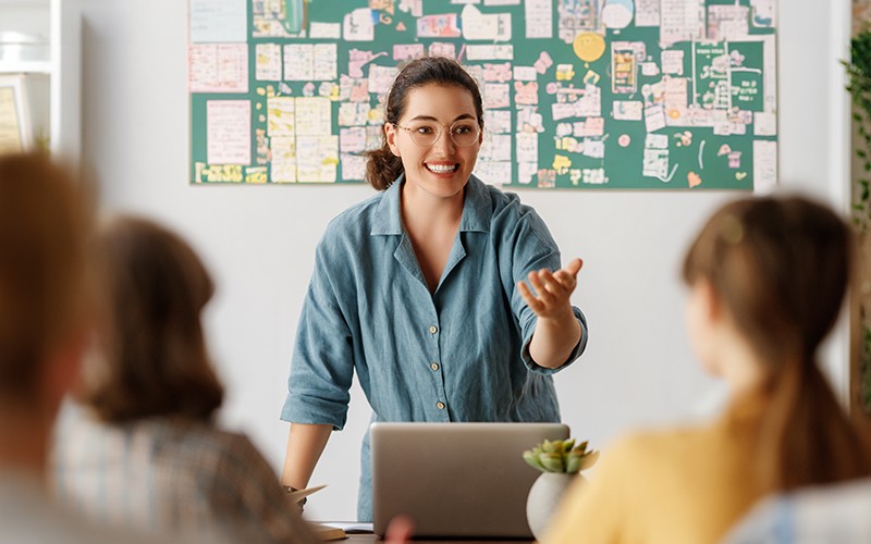 Teacher discussing in front of students