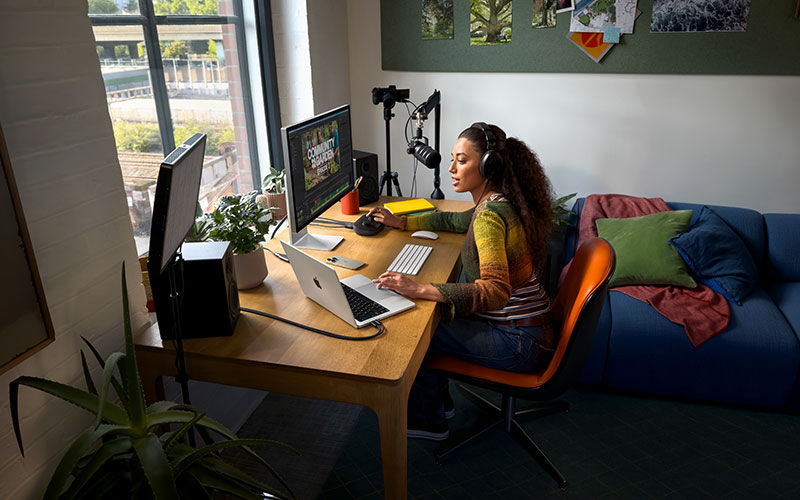 User typing on laptop