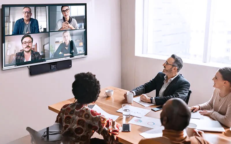 Professionals collabotaing with each other using AVer VB342