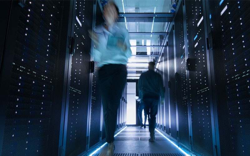  Two people walking through data center security