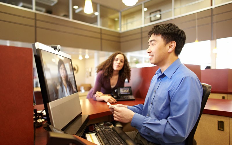 Employee using Cisco desktop and web cam device