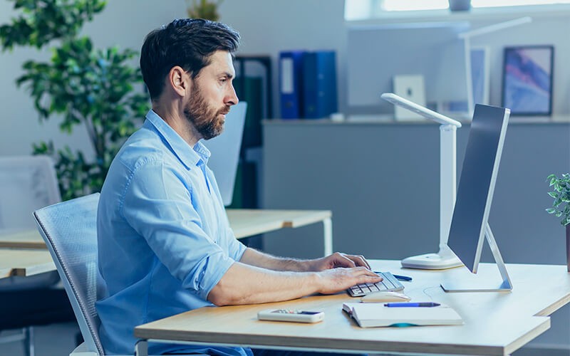 Man working using his computer