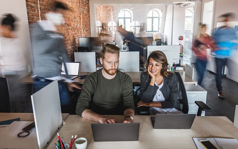 Two colleagues talking to each other