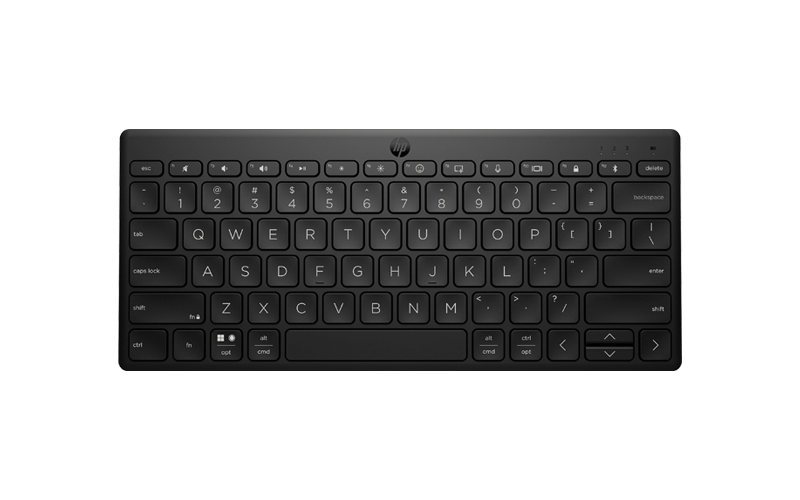 Man using HP desktop and desktop accessories