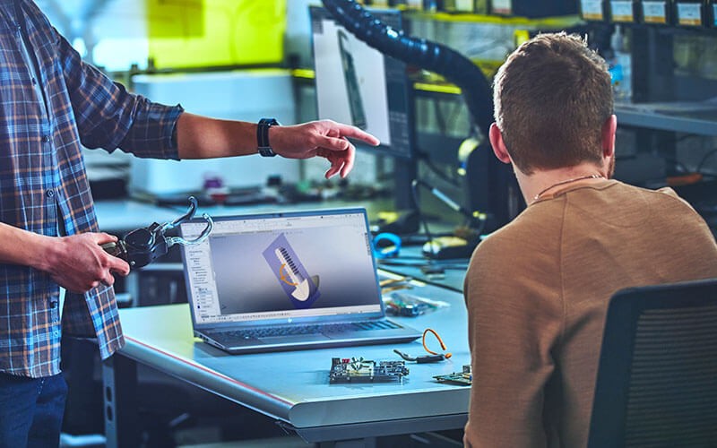 Man using his laptop at work