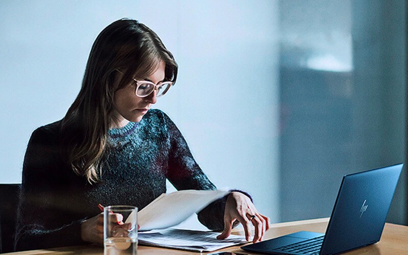 Woman working using HP laptop