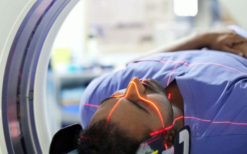 Man in hospital receiving a health scan