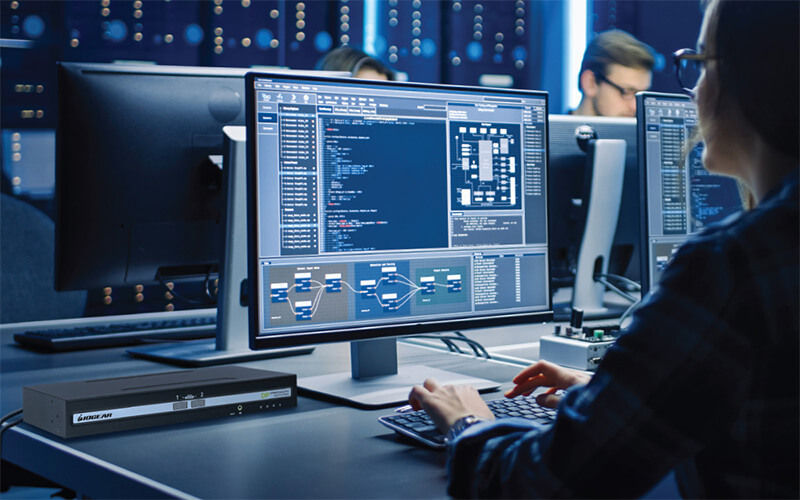 Woman coding at the data center