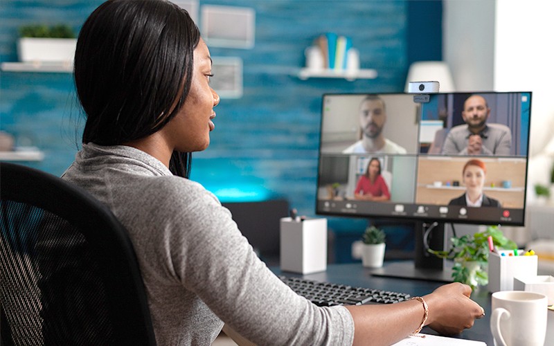 Woman having a meeting using JLab webcam