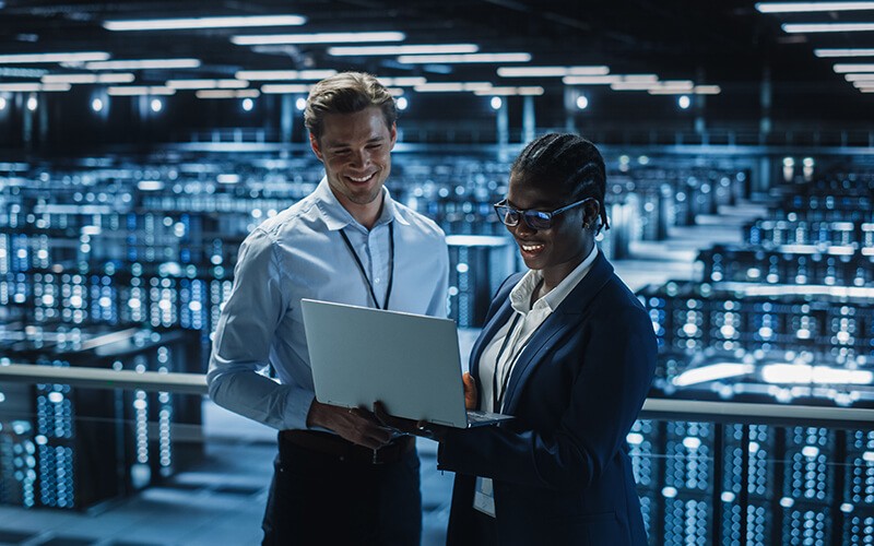 Two person collaborating inside the data center