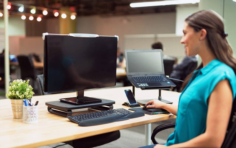 Woman using her privacy monitor at work