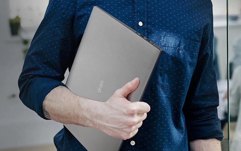 Professional holding a laptop