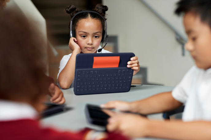 A kid using iPad for learning