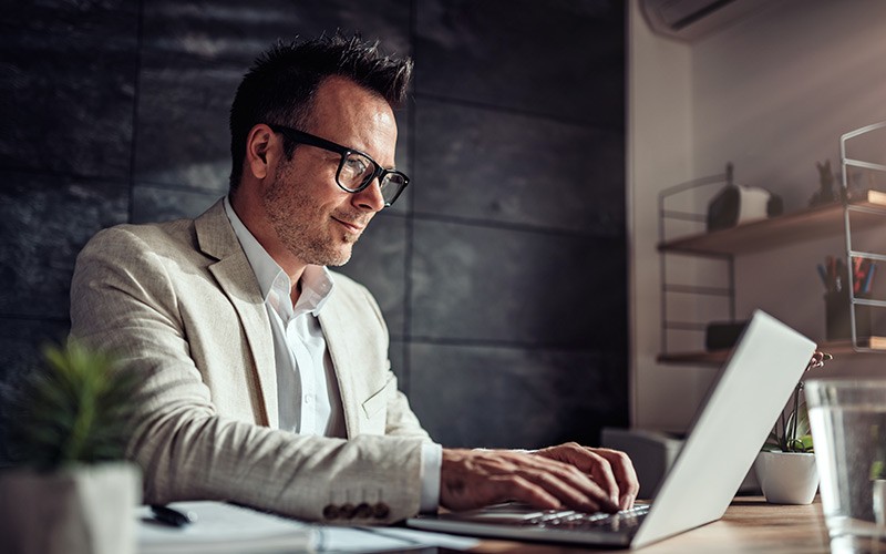 Professional working on his laptop
