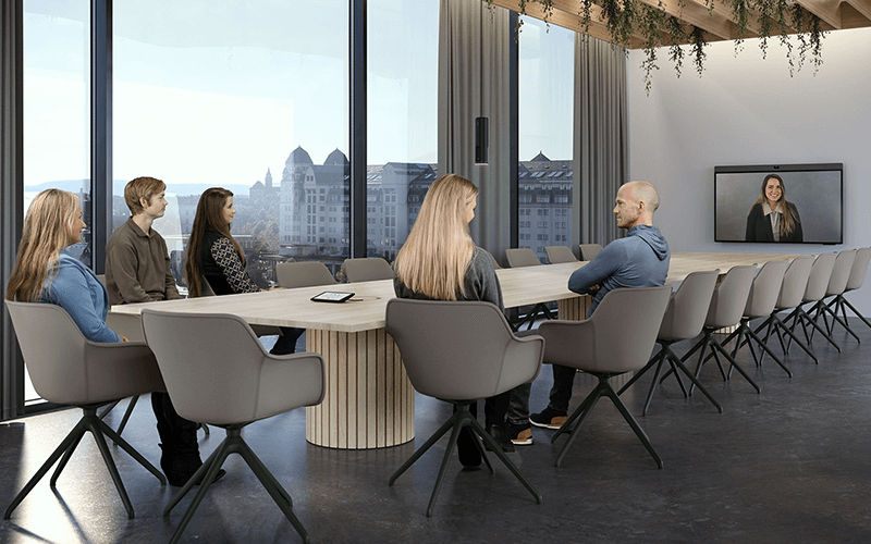 Teammates having a meeting in a large spaces