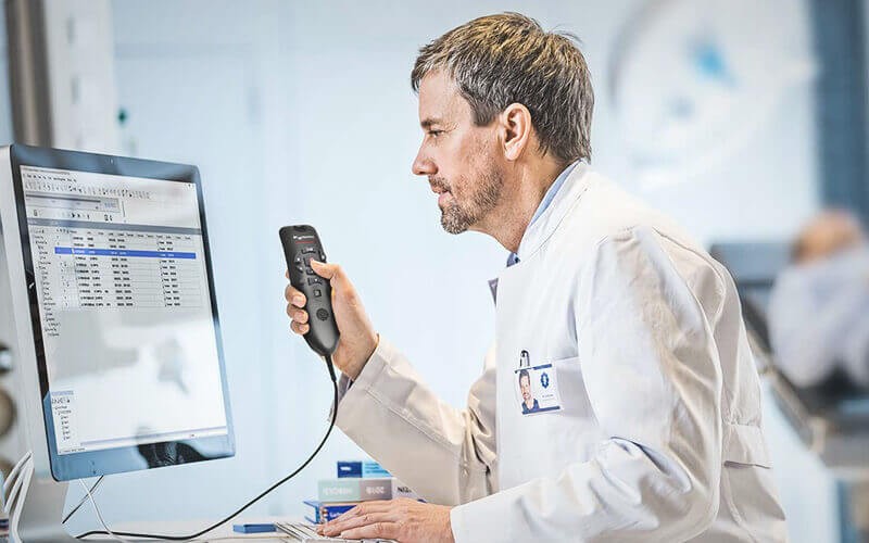 A medical professional  working with a nuance product solution