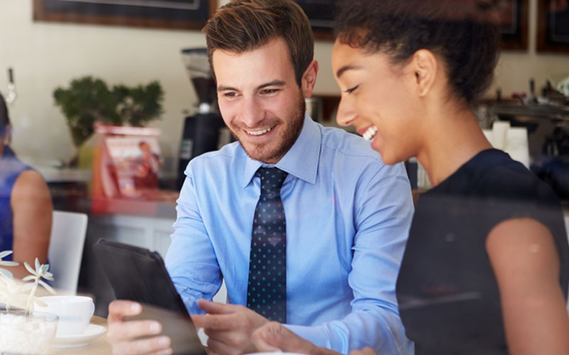 Nutanix Enterprise Cloud Platform Two professionals working remote on laptop device