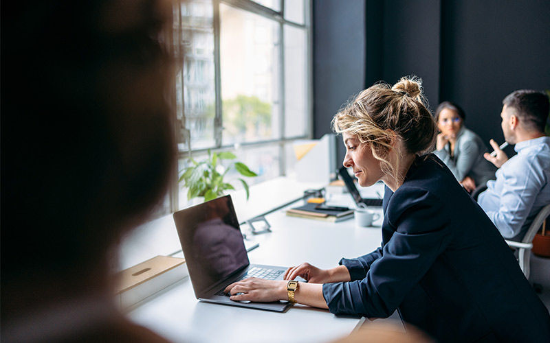 Enterprise applications gives you stability and performance Business man using laptop at desk