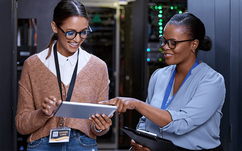 Explore additional resources Teammates collaborating together at the office