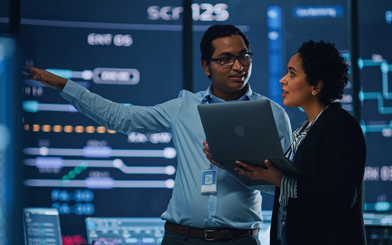 Two workers discussing about their work