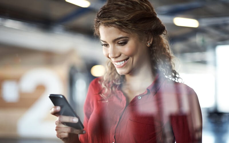 Woman smiling on mobile phone