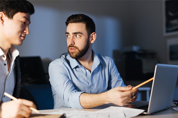 Two men collaborating