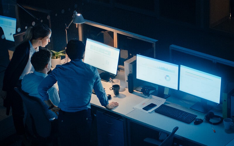 Professional working together at night