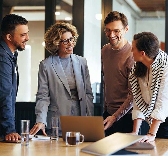 Two business professionals reviewing technical data on a tablet at work.