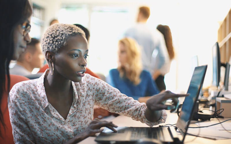 Woman collaborating working on laptop