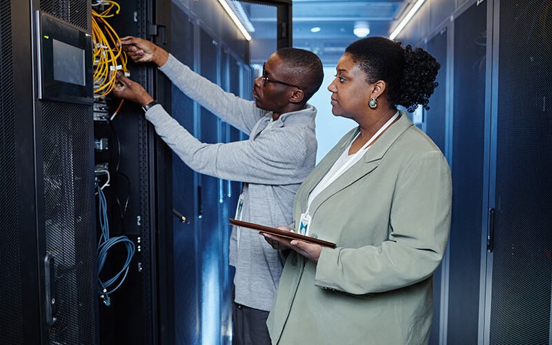 Two person inside the data center