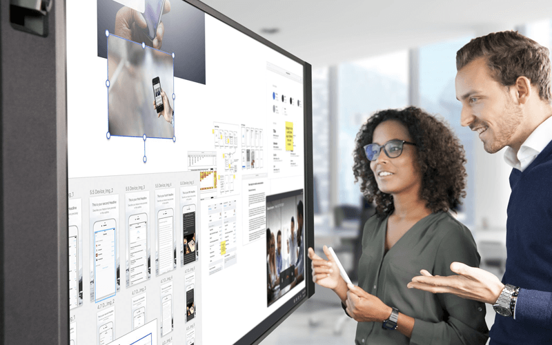 Teammates using Sharp commercial display