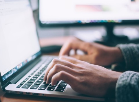 Data growth and AI are taking cybersecurity risks to new heights hands typing on a laptop