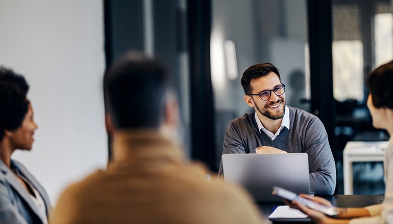 Software challenges end here Businessman on laptop computer in office