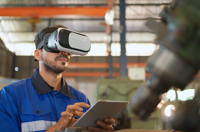 engineer-wearing-virtual-headset-in-manufacturing-factory